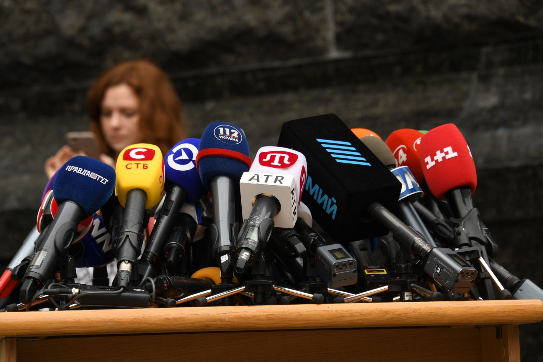 Speakers answering questions at a press conference
