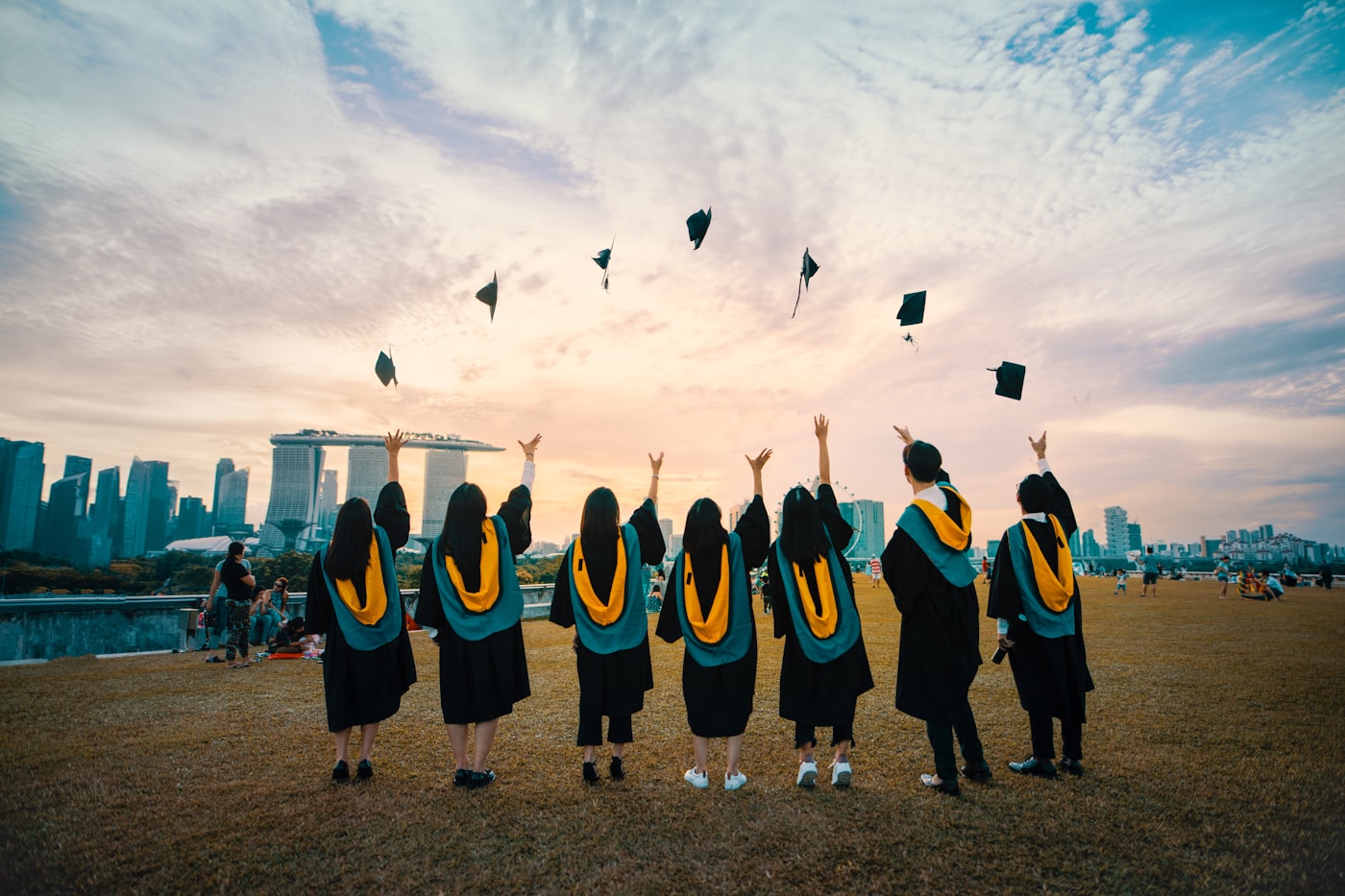 Graduates celebrating in caps and gowns