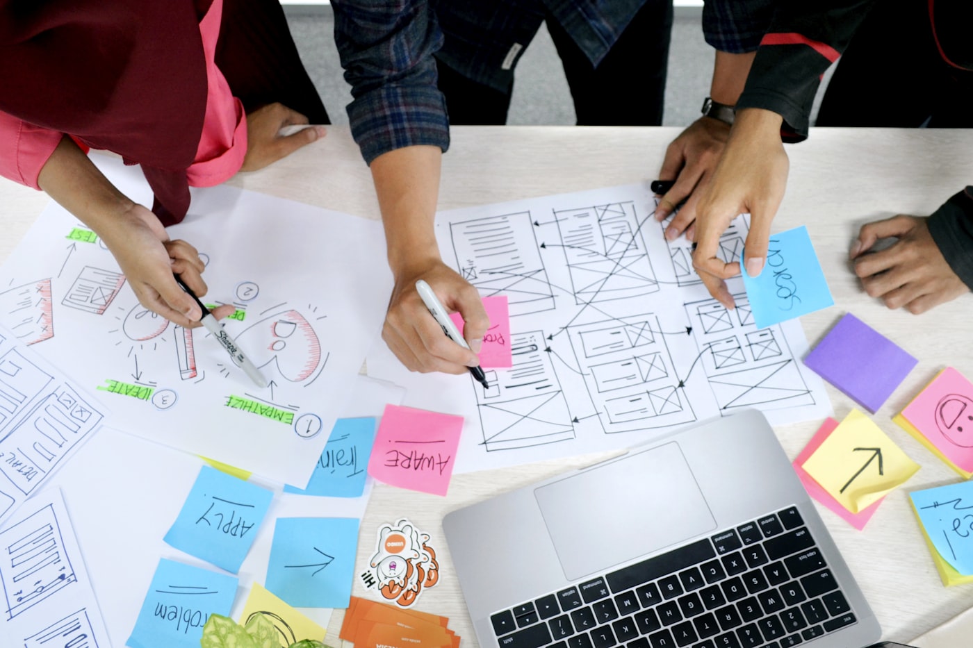 A design sprint team mapping ideas on a board