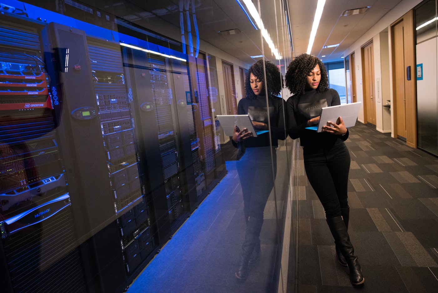 Two women working on a technology project at a laptop