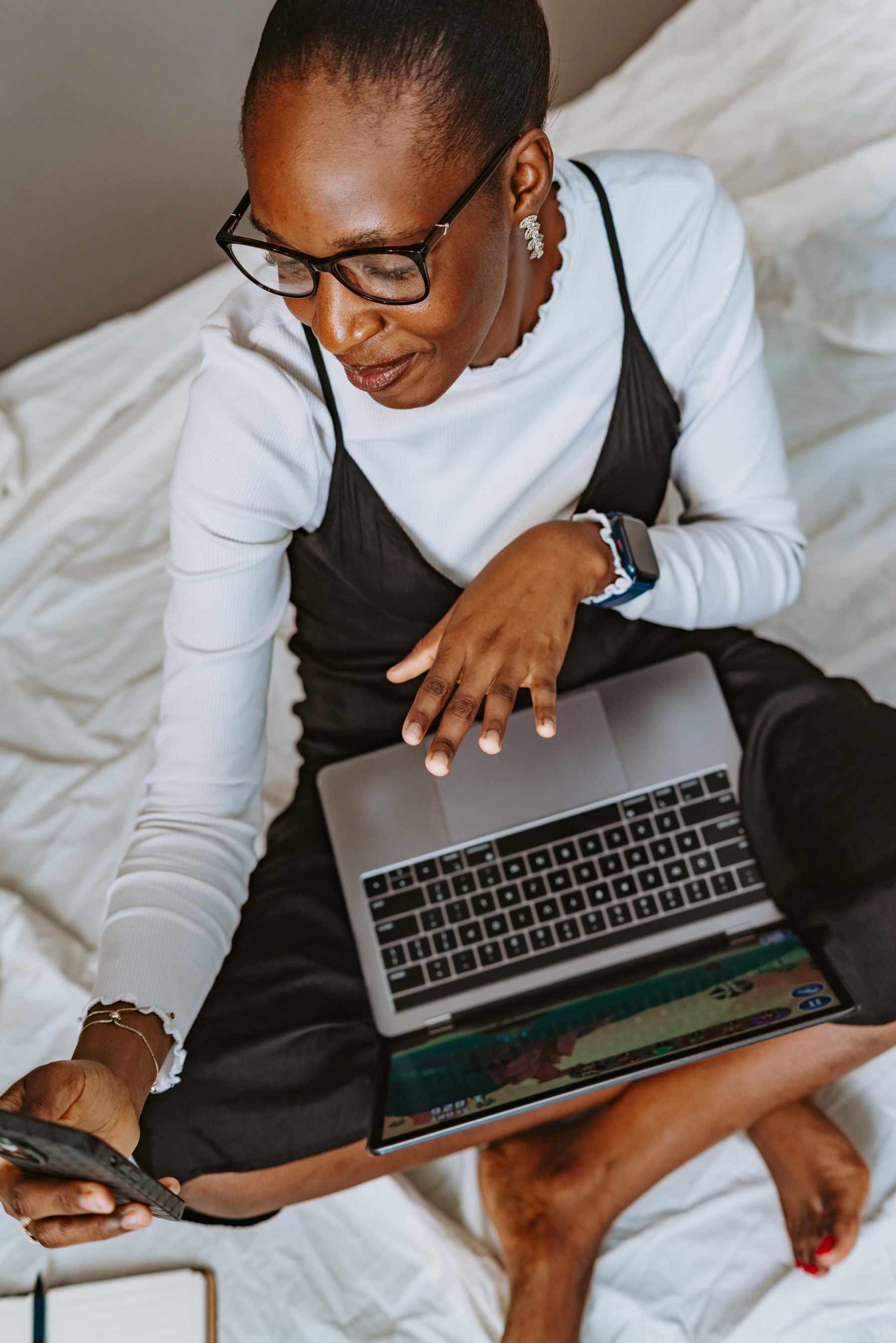 A woman working focused on her laptop