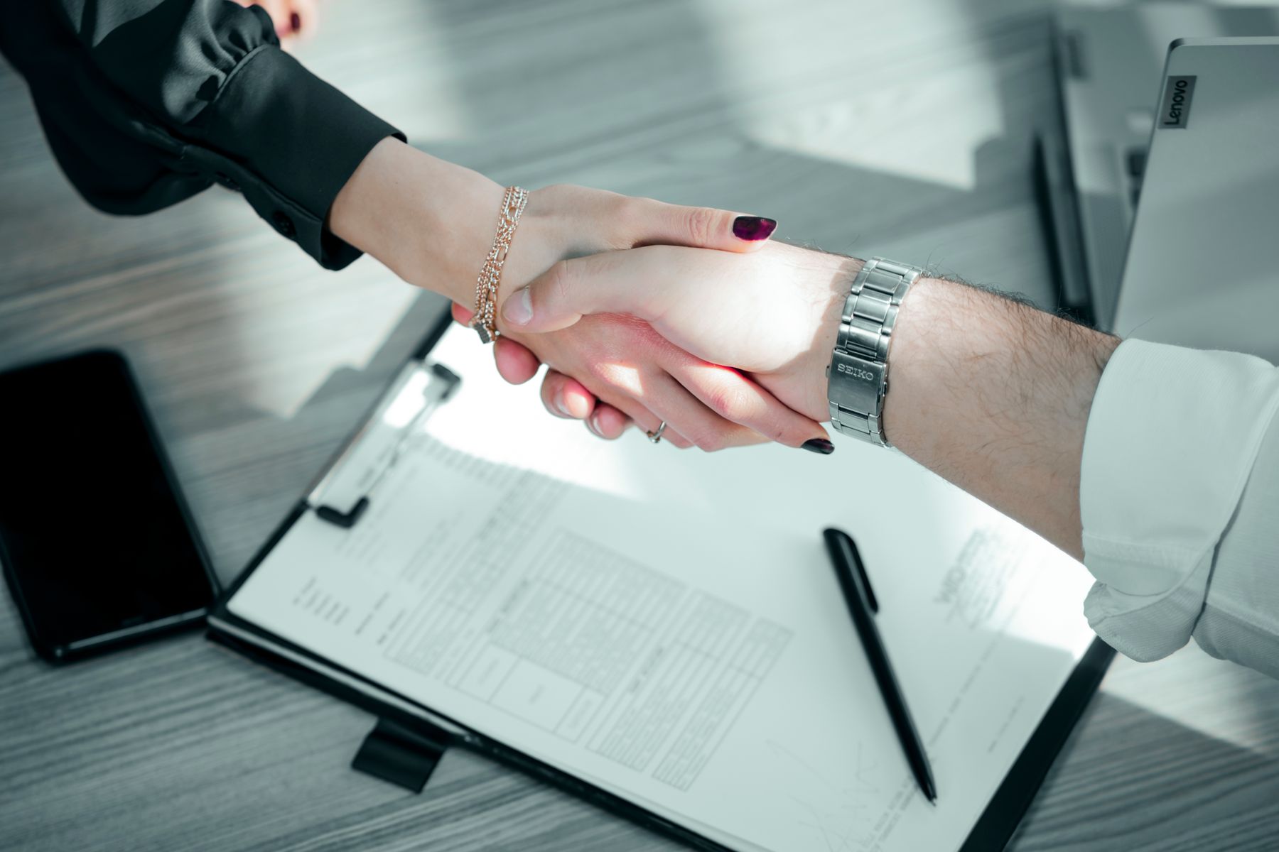 Two partners signing a cooperation agreement