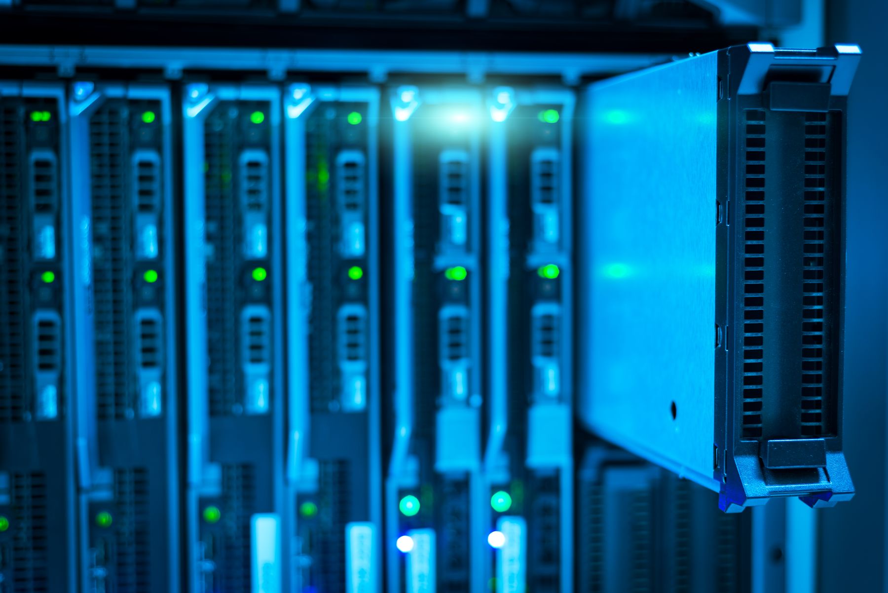 Server racks with blinking status lights in a data centre