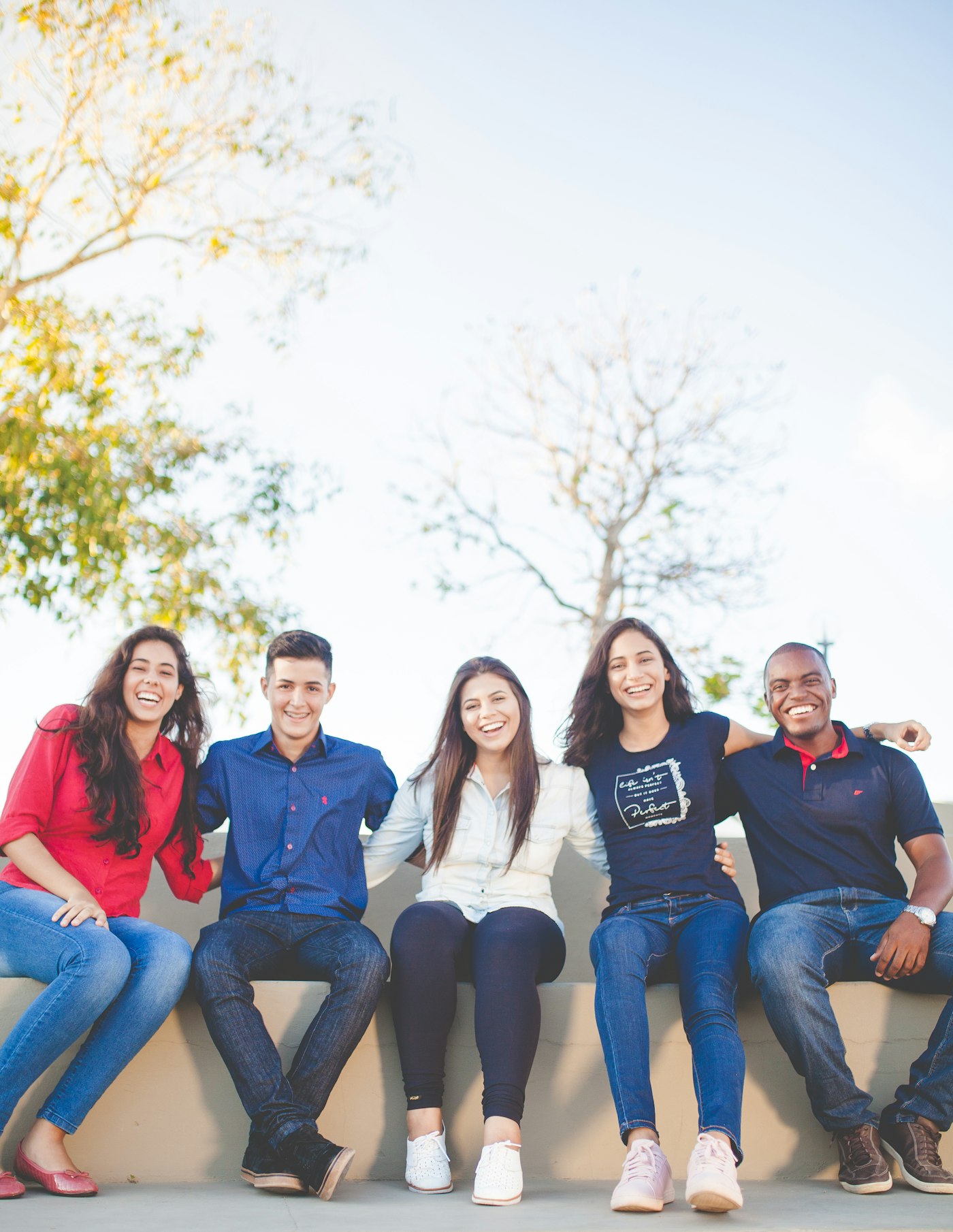 Students studying together outdoors on campus